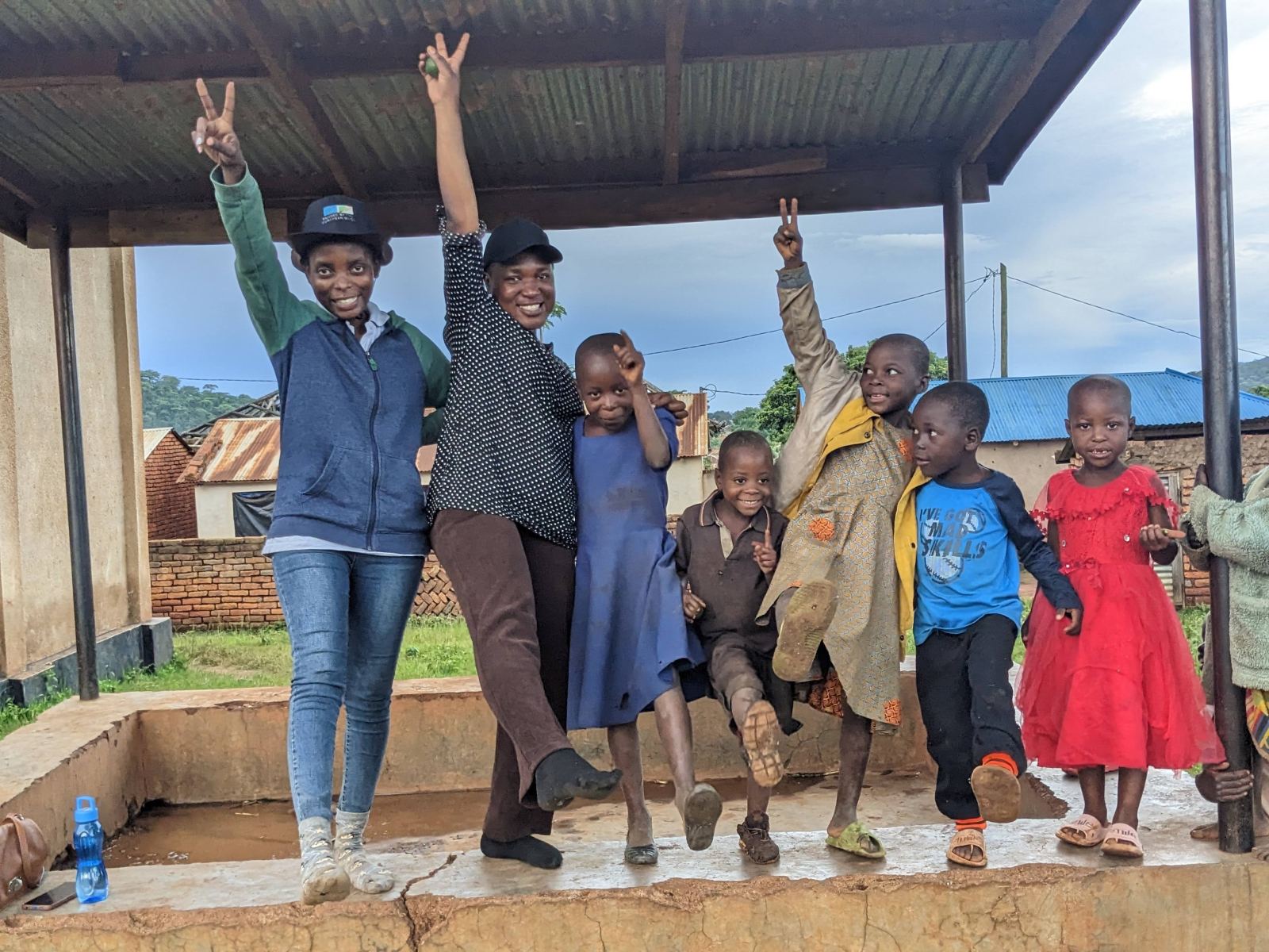 The ELO team celebrating with children in the community